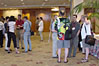 Attendees meet in 
the ballroom foyer.