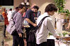 Attendees gather at the sushi table.